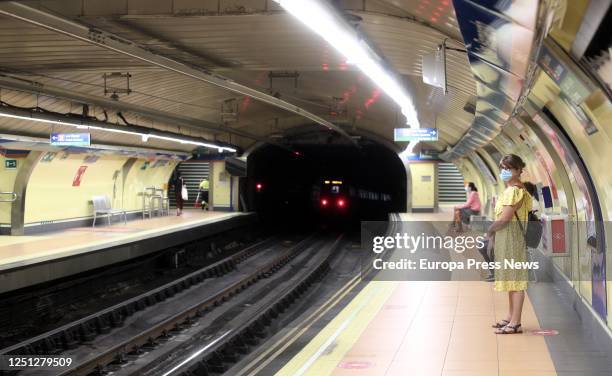 Passenger with a mask is seen waiting for the train at a platform at San Bernardo subway station on June 22, 2020 in Madrid, Spain. The Community of...