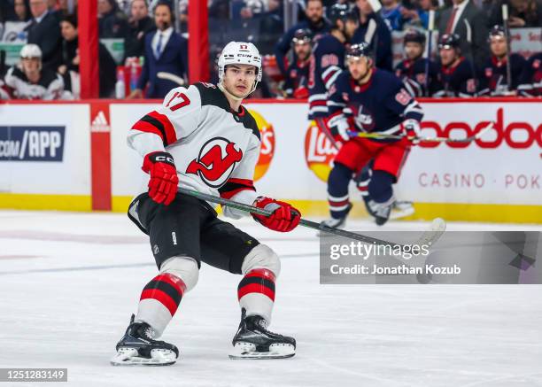 Yegor Sharangovich of the New Jersey Devils skates during second period action against the Winnipeg Jets at Canada Life Centre on April 02, 2023 in...