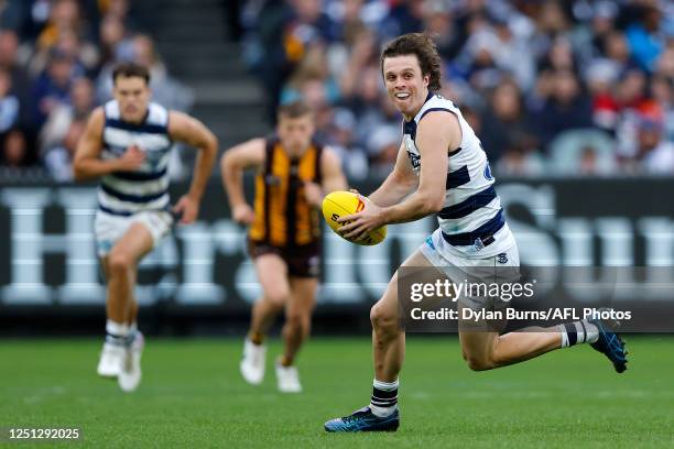 Max Holmes of the Cats in action during the 2023 AFL Round 04 match between the Geelong Cats and the Hawthorn Hawks at the Melbourne Cricket Ground...