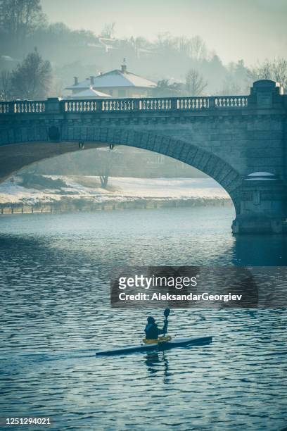 kayak under po river and bridge to gran madre church in turin italy - turin cathedral stock pictures, royalty-free photos & images