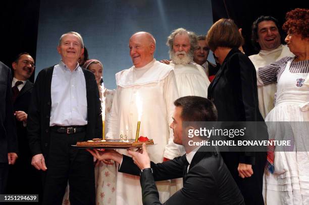 French actor Michel Bouquet prepares to blow the candles on his birthday cake next to French Culture Minister Christine Albanel and director Georges...