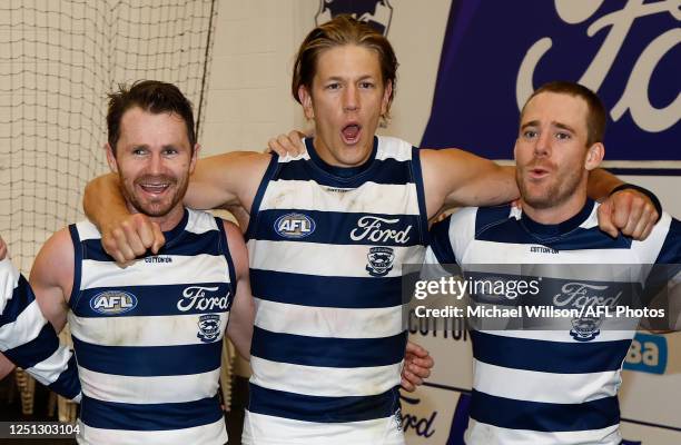 Patrick Dangerfield, Rhys Stanley and Cameron Guthrie of the Cats sing the team song during the 2023 AFL Round 04 match between the Geelong Cats and...