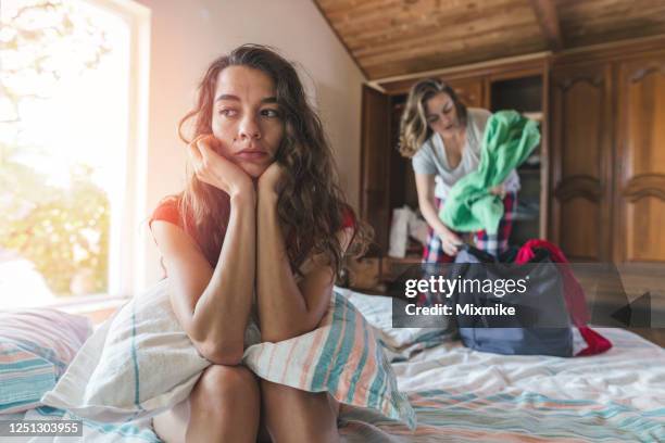 breaking up during quarantine - lesbian bed stock pictures, royalty-free photos & images