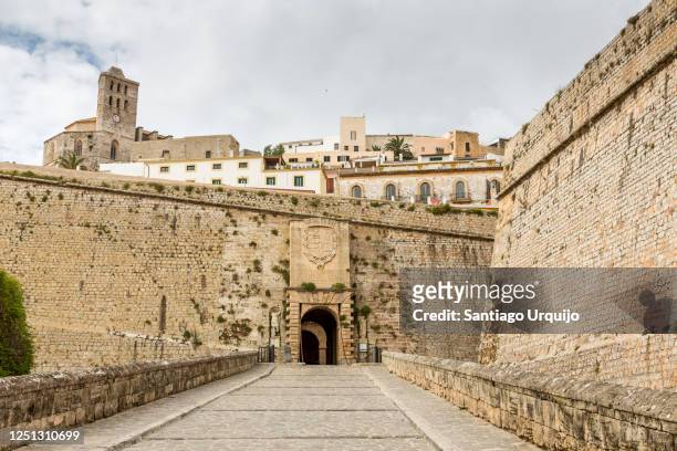 street leading to fortified walls of ibiza - ibiza town stock pictures, royalty-free photos & images