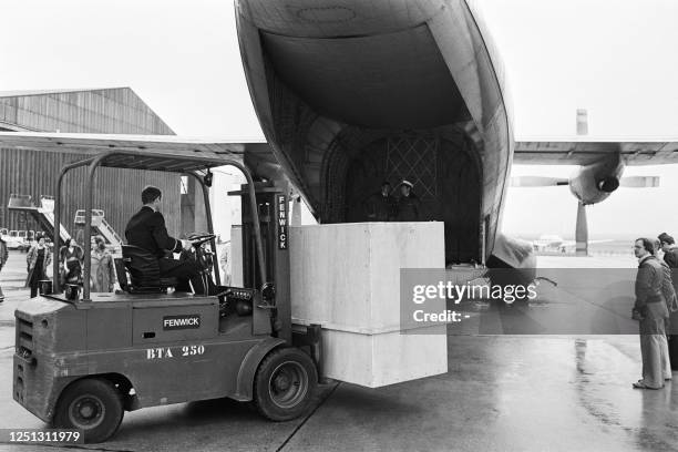 Photo taken on September 26, 1976 shows the mummy of Egyptian pharaoh Ramses II being loaded on the tarmac of Le Bourget airport as it returns to...