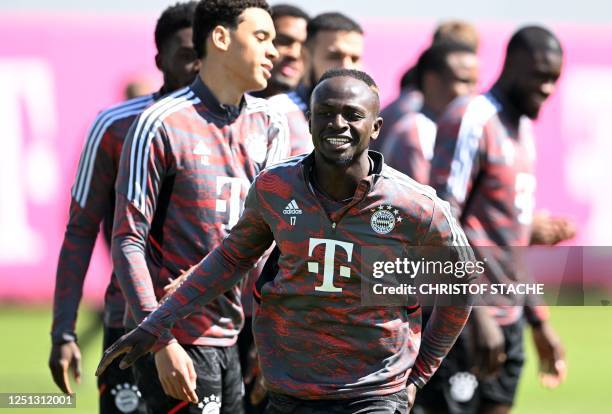 Bayern Munich's Senegalese forward Sadio Mane runs in front of teammates during the training session on the eve of the UEFA Champions League quarter...