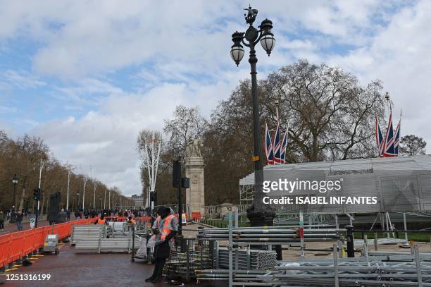 Barriers are pictured near Buckingham Palace in central London on April 10 as preparations get underway ahead of the Coronation of Britain's King...