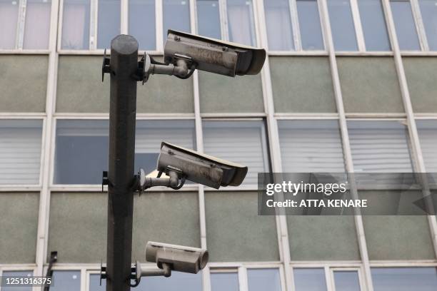 Closed-circuit television cameras are pictured in a street in Tehran on April 10, 2023. - Police in Iran said on April 8 they plan to use "smart"...