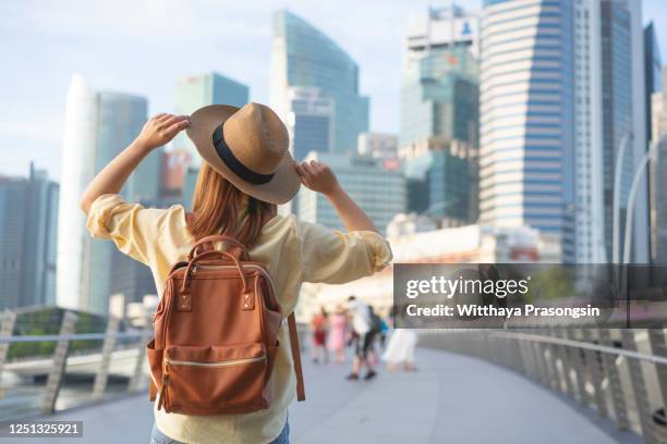 woman tourist on the street traveling in singapore - gardens by the bay stock pictures, royalty-free photos & images