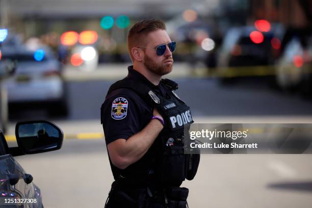 Police officer stands by at an active shooter incident near the Old National Bank building on April 10, 2023 in Louisville, Kentucky. According to...