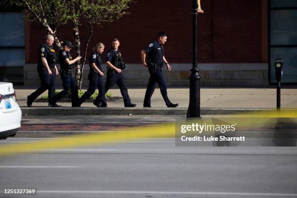 Law enforcement officers respond to an active shooter near the Old National Bank building on April 10, 2023 in Louisville, Kentucky. According to...