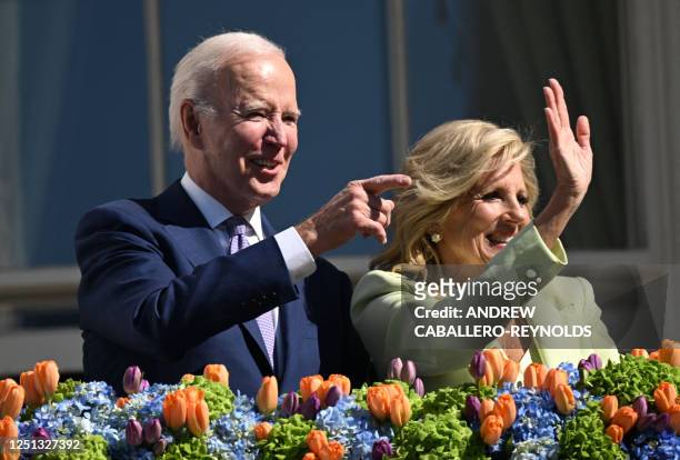 President Joe Biden, alongside First Lady Jill Biden waves after speaking at the annual Easter Egg Roll on the South Lawn of the White House in...