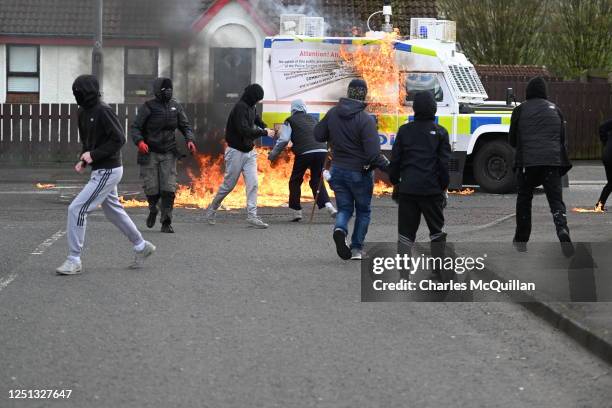 Police vehicle is attacked with petrol bombs during an illegal Dissident march in the Creggan area on April 10, 2023 in Londonderry, Northern...