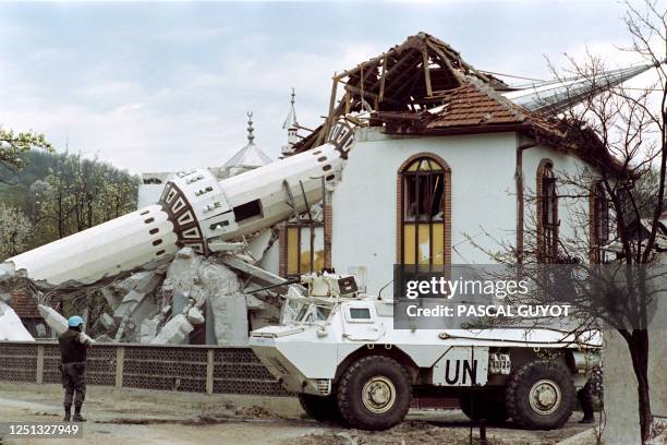 French troops of the United Nations patrol in front of the destroyed mosque of Ahinici, near Vitez, northwest of Sarajevo 27 April 1993. This Moslem...