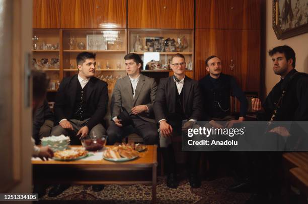 Boys and younger men from the Ilosvai Selymes Peter folk dance group attend the traditional watering of local girls on Easter Monday in Komarovce,...