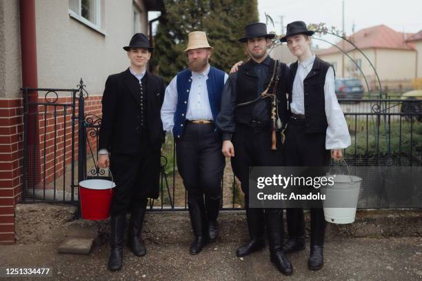 Boys and younger men from the Ilosvai Selymes Peter folk dance group attend the traditional watering of local girls on Easter Monday in Komarovce,...