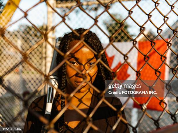 young black woman at the softball - baseball team stock pictures, royalty-free photos & images