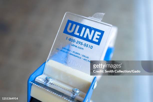 Close-up of logo for shipping and logistics supply company Uline on packing tape dispenser, San Ramon, California, June 18, 2020.