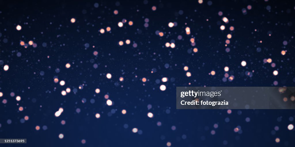 Defocused Lights and Particles Background