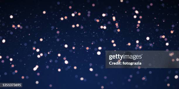 defocused lights and particles background - star dust stock pictures, royalty-free photos & images