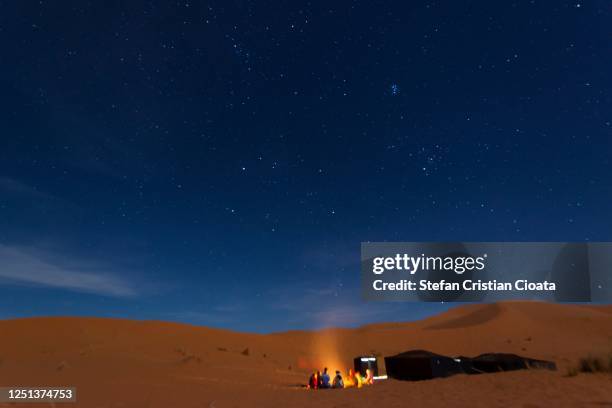 bedouin night at the camp, with music and dancing, erg chebbi sand dune, morocco - desert camping stock pictures, royalty-free photos & images