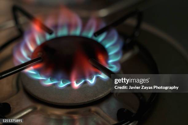 flame on gas stove burner - gas stove cooking stock pictures, royalty-free photos & images