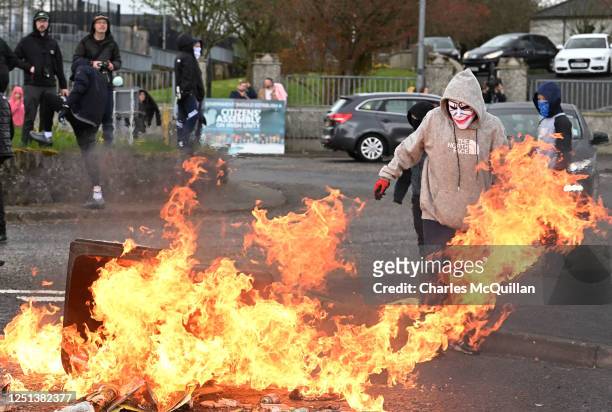 Dissident republican youths create a road block following an illegal Dissident march in the Creggan area on April 10, 2023 in Londonderry, Northern...