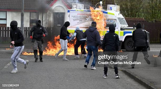 Police vehicle is attacked with petrol bombs during an illegal Dissident march in the Creggan area on April 10, 2023 in Londonderry, Northern...