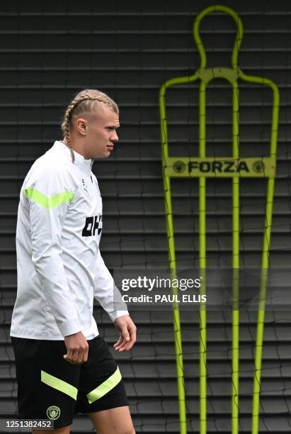 Manchester City's Norwegian striker Erling Haaland attends a team training session at Manchester City training ground in Manchester, north-west...