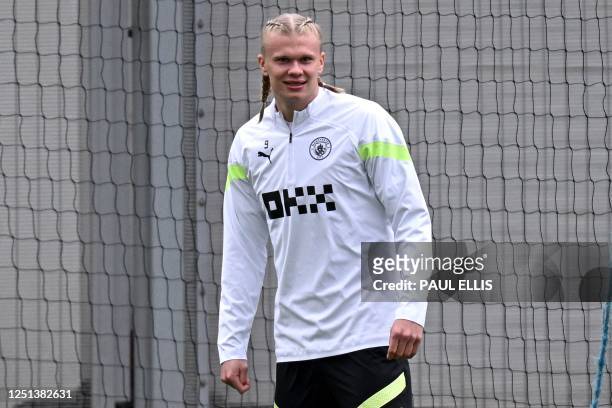 Manchester City's Norwegian striker Erling Haaland attends a team training session at Manchester City training ground in Manchester, north-west...