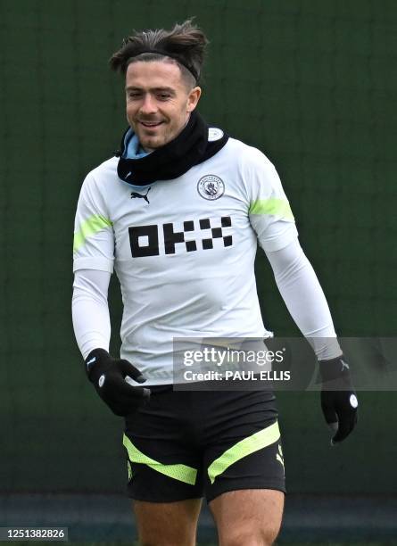 Manchester City's English midfielder Jack Grealish attends a team training session at Manchester City training ground in Manchester, north-west...