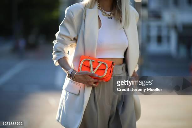 Leonie Hanne wearing Valentino bag, Off white top, Storets blazer and Frankie Shop pants on June 21, 2020 in Hamburg, Germany.
