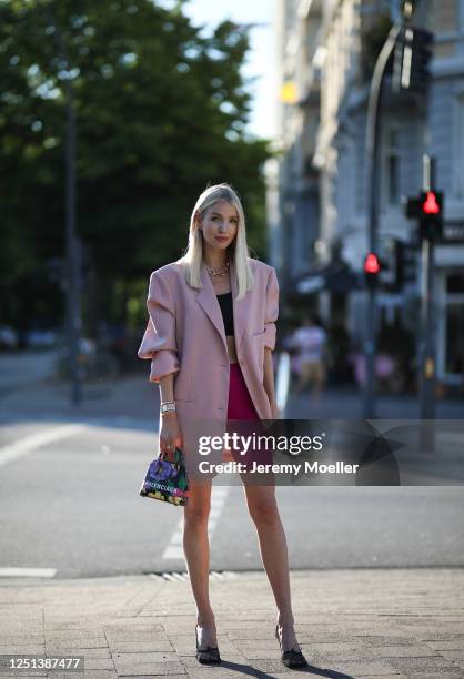 Leonie Hanne wearing Bottega Veneta heels, Balenciaga bag, Frankie Shop blazer, Skims top, Nanushka pants and Fendi watch on June 21, 2020 in...