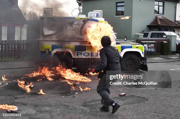 Police vehicle is attacked with petrol bombs during an illegal Dissident march in the Creggan area on April 10, 2023 in Londonderry, Northern...