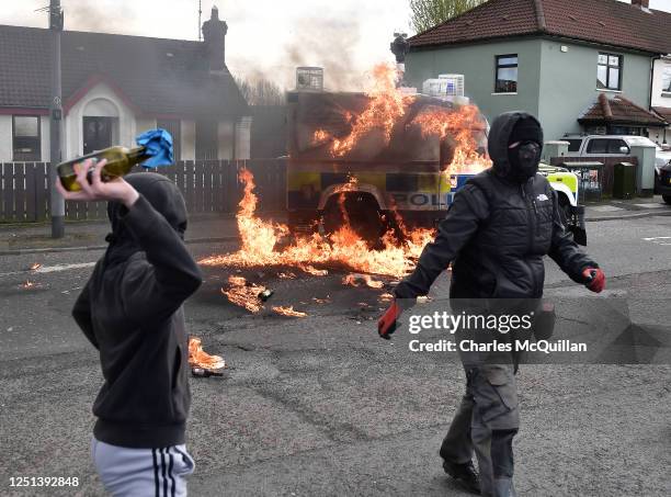 Police vehicle is attacked with petrol bombs during an illegal Dissident march in the Creggan area on April 10, 2023 in Londonderry, Northern...