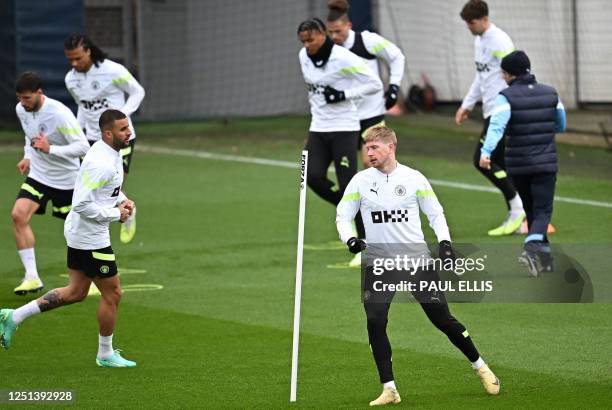 Manchester City's Belgian midfielder Kevin De Bruyne and Manchester City's English defender Kyle Walker attends a team training session at Manchester...
