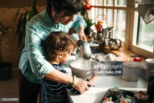 mixing whipped cream. - electric mixer stock pictures, royalty-free photos & images