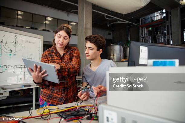 supporting each other - engineering student stock pictures, royalty-free photos & images