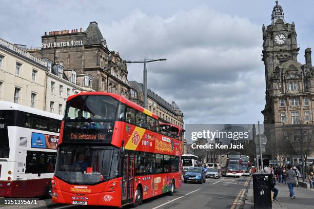 Sightseeing bus makes its way along Edinburgh's main thoroughfare, Princes Street, on Easter Monday, with some of the city's famous landmarks in the...