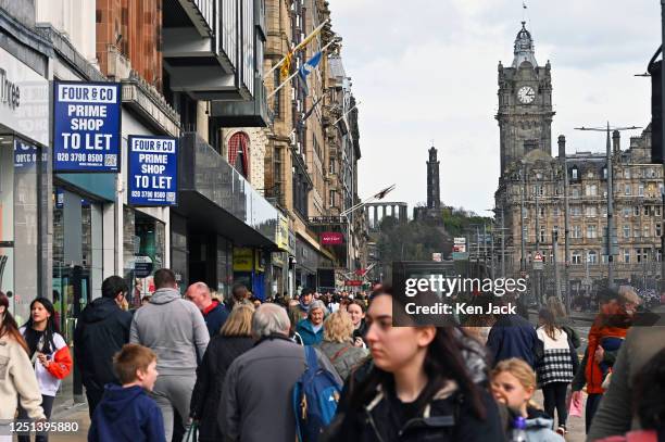 Shoppers and tourists throng Edinburgh's main thoroughfare, Princes Street, on Easter Monday, with some of the city's famous landmarks in the...