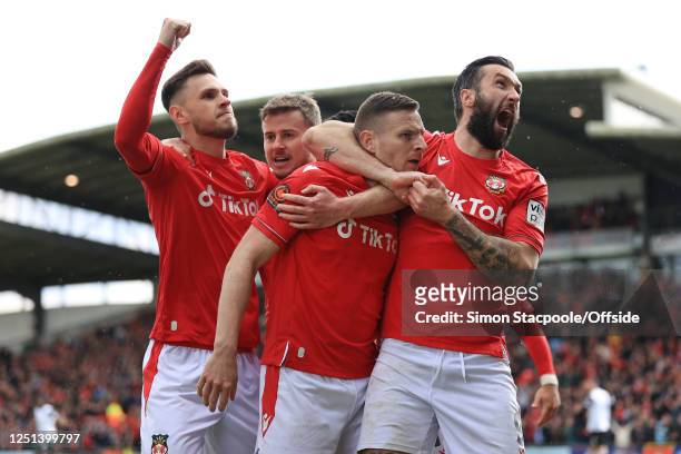 Paul Mullin of Wrexham celebrates with Ollie Palmer of Wrexham after scoring their 1st goal during the Vanarama National League match between Wrexham...