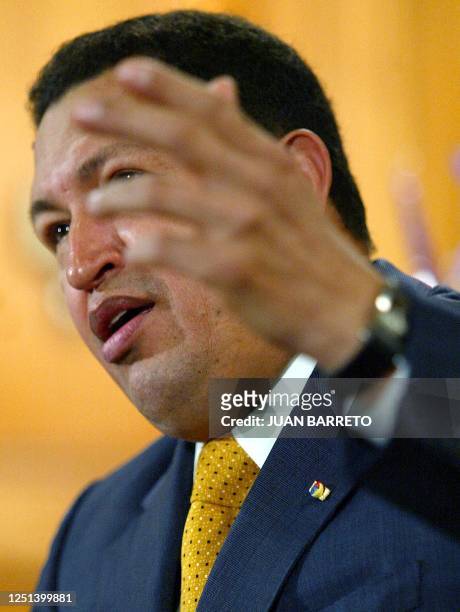 President Hugo Chávez answers questions from reporters at the presidential palace 31 October 2002. Chavez is working with Gaviria to find solutions...