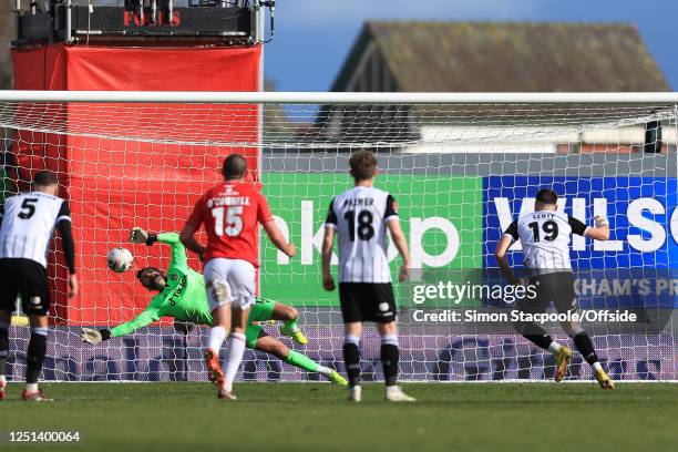 Wrexham goalkeeper Ben Foster saves a late penalty from Cedwyn Scott of Notts County during the Vanarama National League match between Wrexham and...