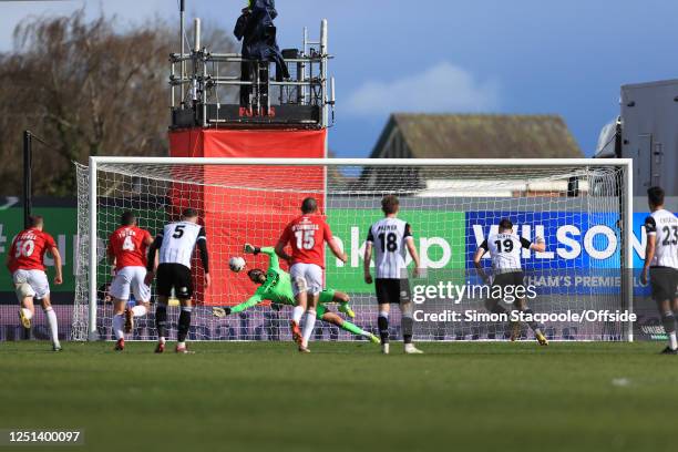 Wrexham goalkeeper Ben Foster saves a late penalty from Cedwyn Scott of Notts County during the Vanarama National League match between Wrexham and...