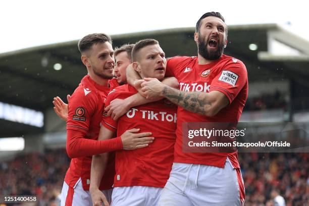 Paul Mullin of Wrexham celebrates with Ollie Palmer of Wrexham after scoring their 1st goal during the Vanarama National League match between Wrexham...