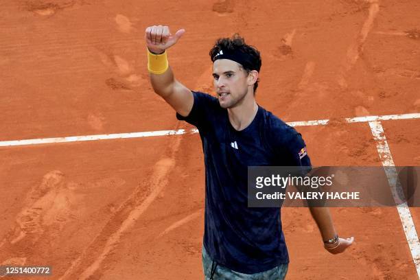 Austria's Dominic Thiem celebrates after winning against France's Richard Gasquet at the end of the Monte Carlo ATP Masters Series Tournament round...