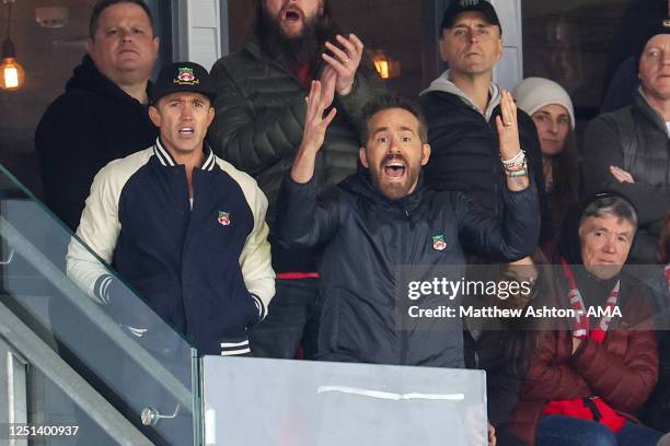 Wrexham Football Club owners Rob McElhenney and Ryan Reynolds watch their team during the Vanarama National League fixture between Wrexham and Notts...