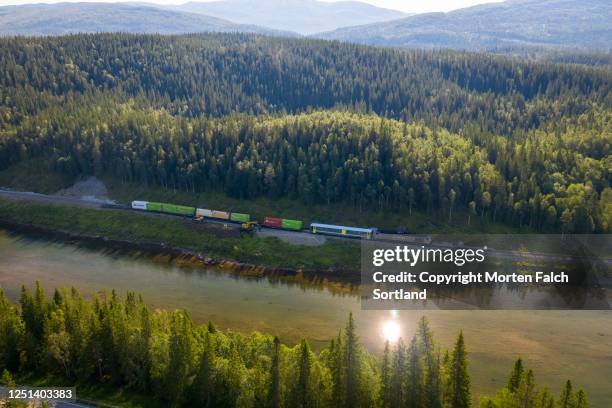 aerial view of a river and the vast forest in namsskogan, norway - derailment stock-fotos und bilder