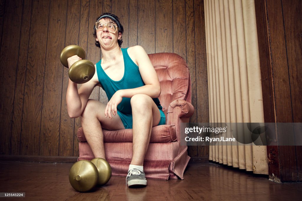 Nerd Young Man Exercising with Weights
