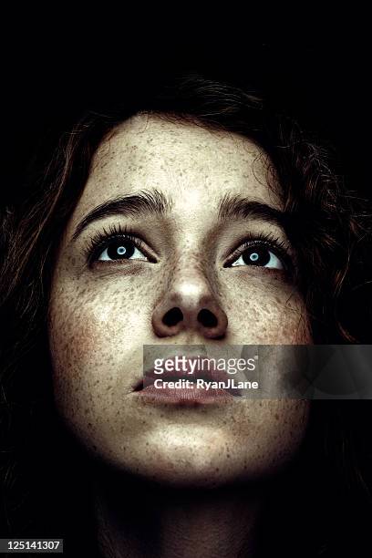 low key portrait of red haired woman with freckles - high contrast bildbanksfoton och bilder